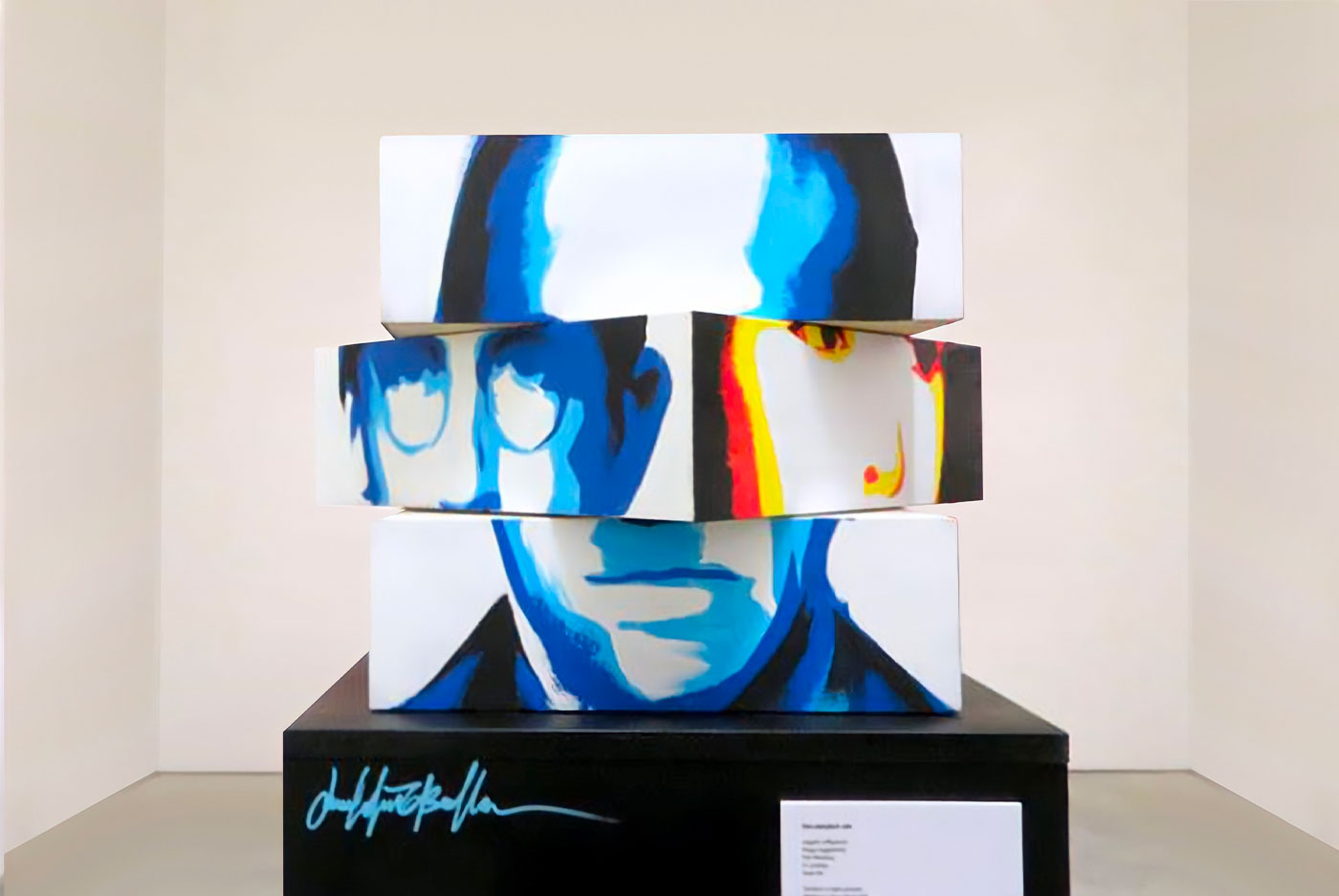 Iconic face fragments illuminated on a candid canvas background.