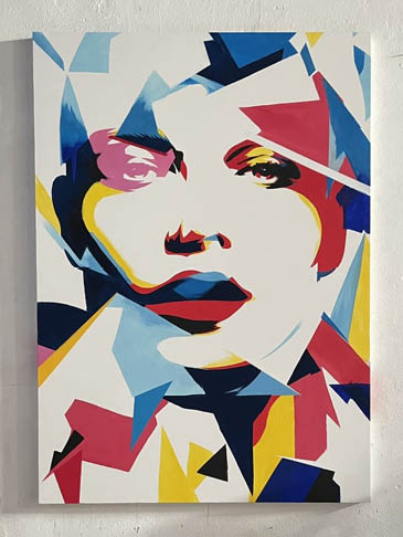 Face fragmented into flowing planes of color and shifting forms.